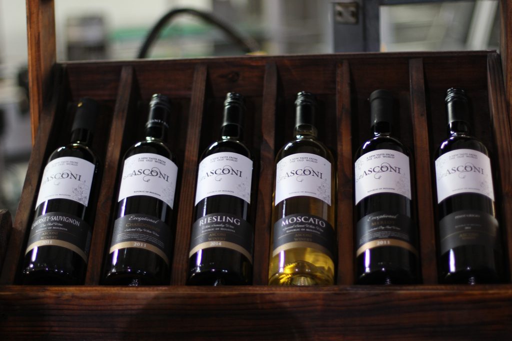 labeled bottles on a rack
