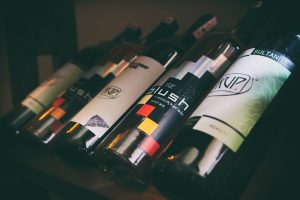 red and white wine bottles displayed