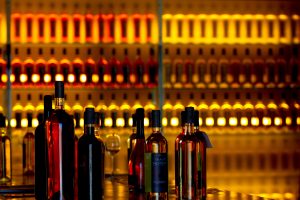 wine bottles on dimly lit shelves